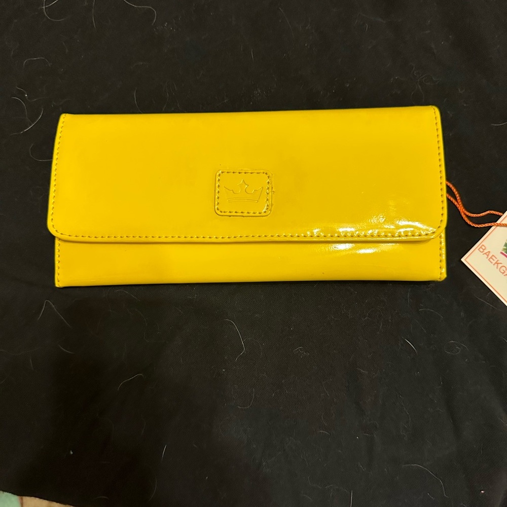This is a Baekgaard clutch wallet in Banana Patton leather.  Bright Yellow